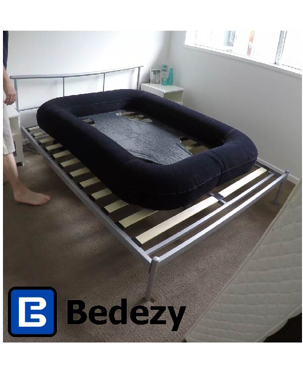 Bedezy inflated which is in a square shape on top of a slat base bed frame without a mattress on top.